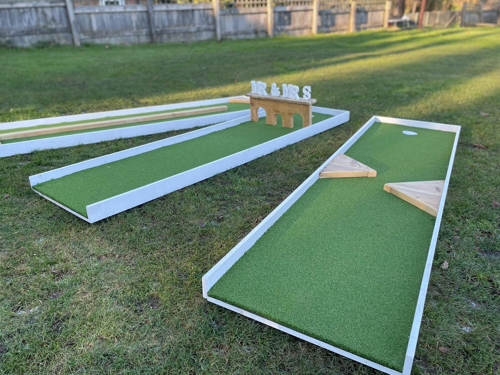 Close-up-of-artificial-turf-golf-lanes-in-garden-from-wedding-hire