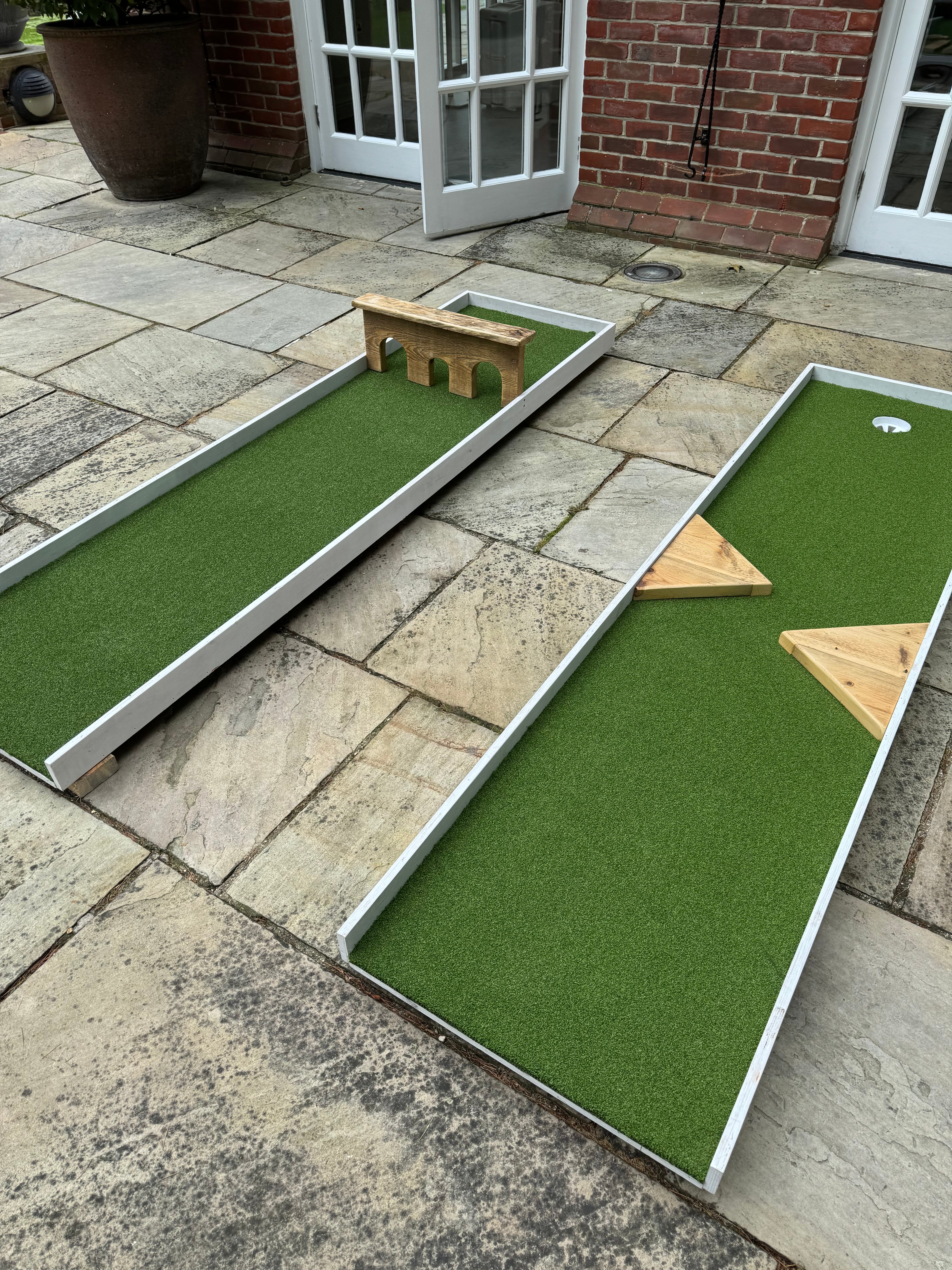 close-up-of-miniature-golf-with-gateway-and-triangle-obstacles 