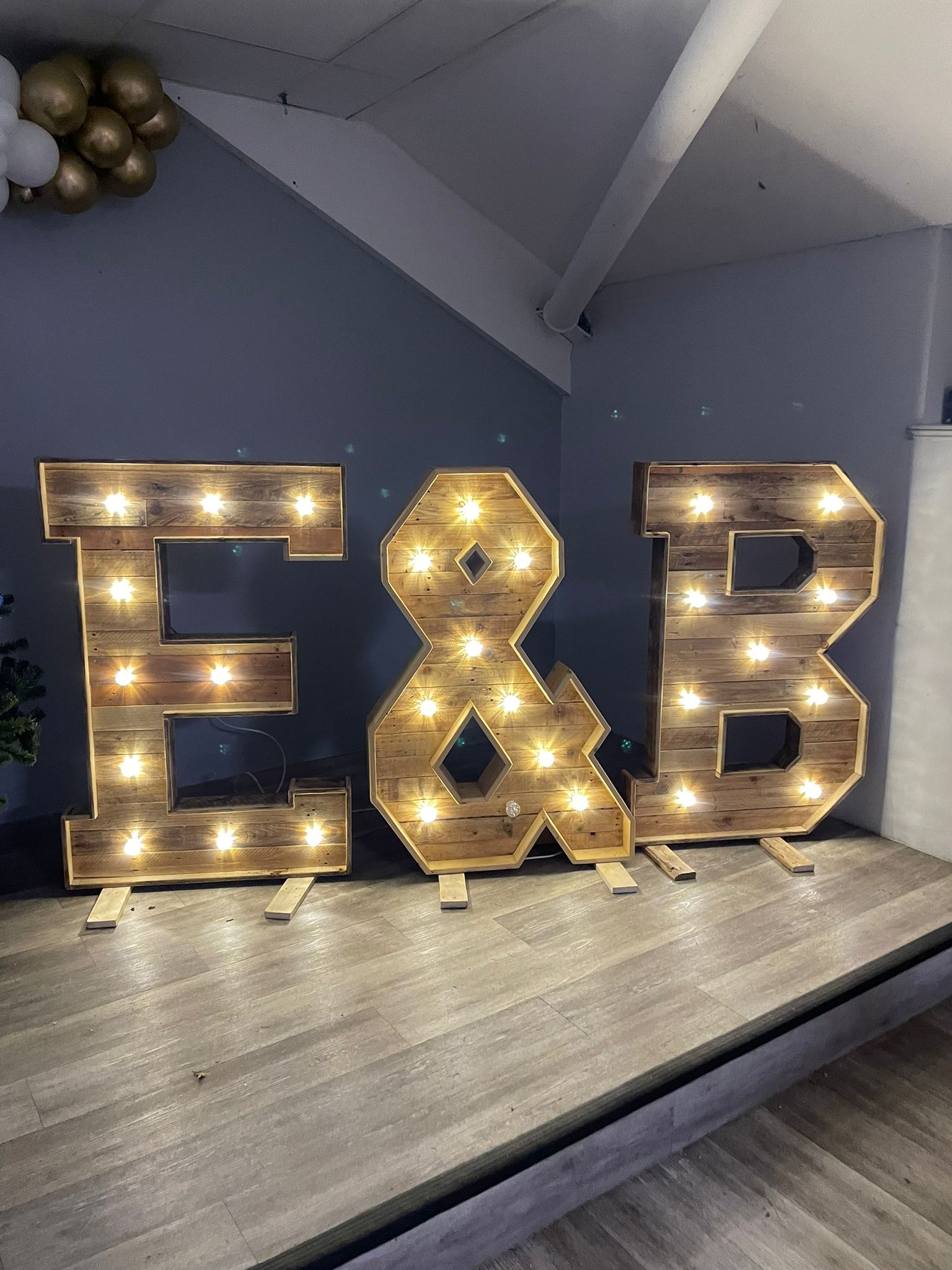 Wood-letter-with-lights-decor-inside-raised-platform-for-https://www.james2.co.uk/